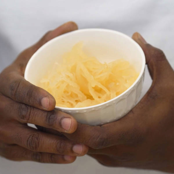hands holding small bowl of sea moss