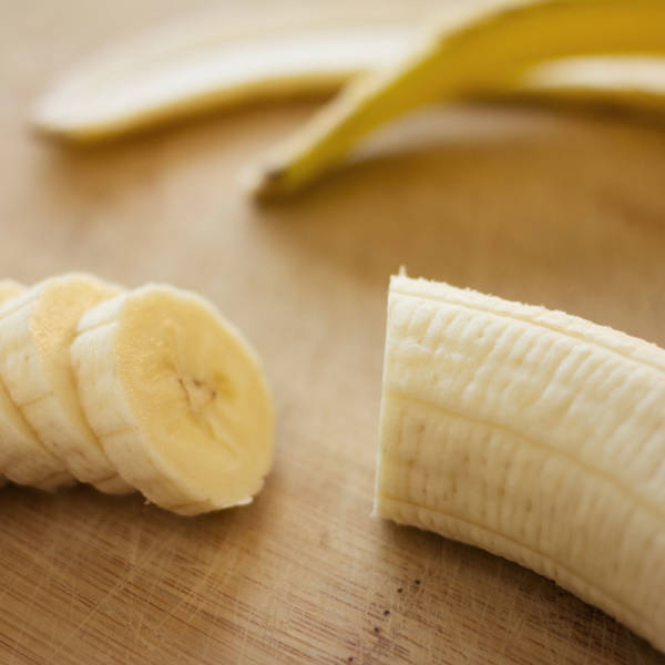 chopped banana on cutting board