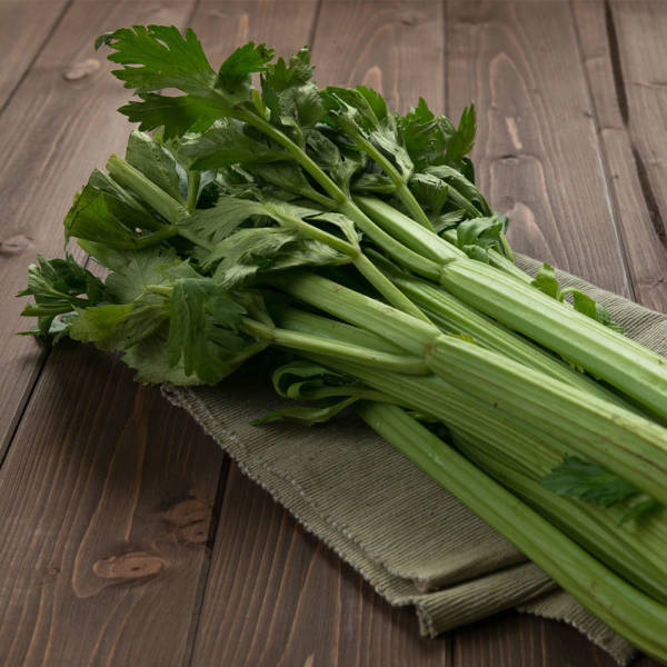celery stalks on wood surface